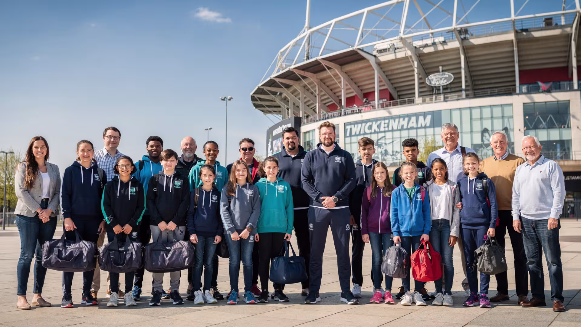 Youth rugby team, coaches and parents outside Twickenham Stadium