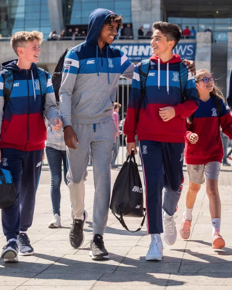 Kids outside a rugby stadium